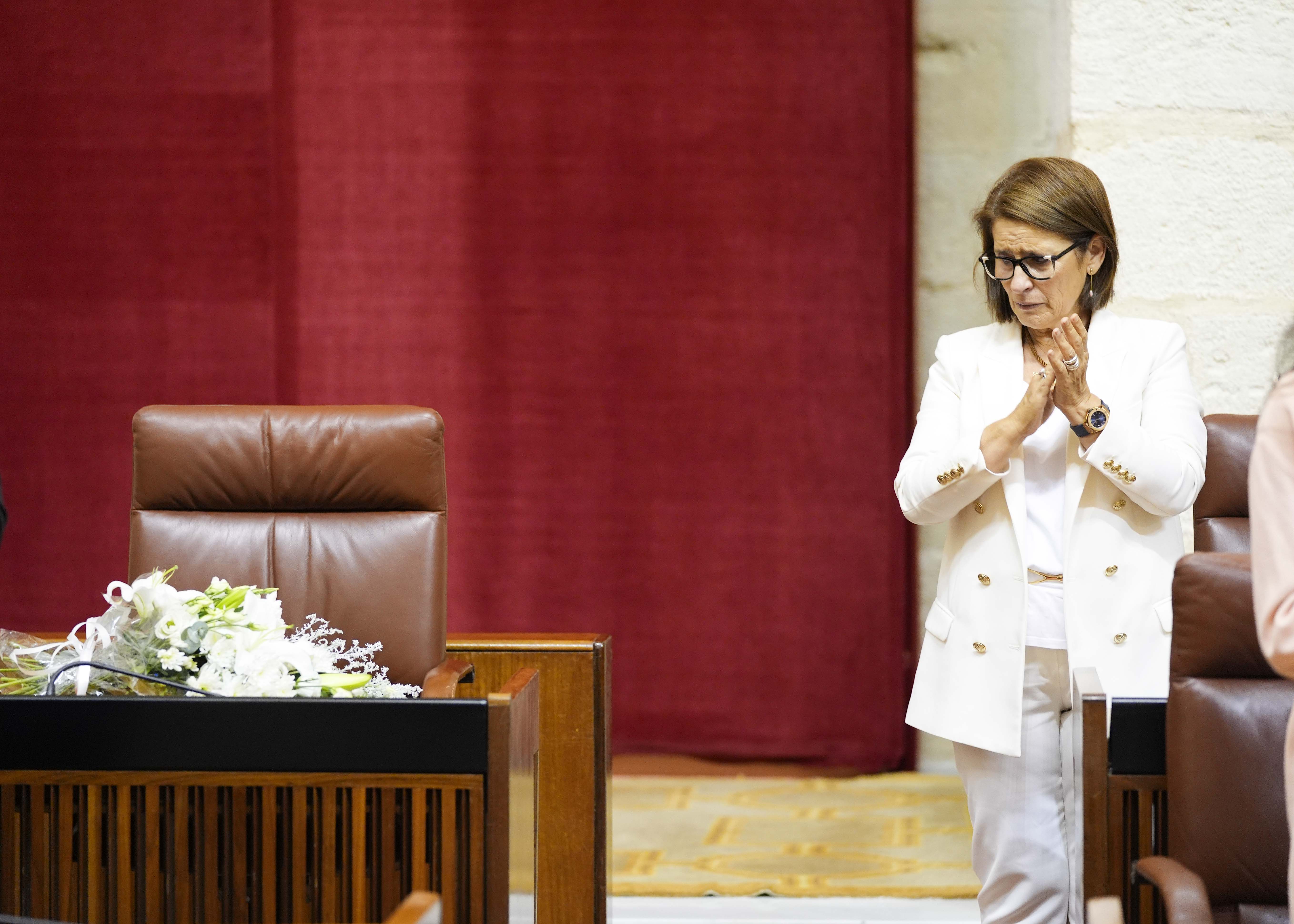 Ramo de flores en el escao que ocupaba la diputada popular 
