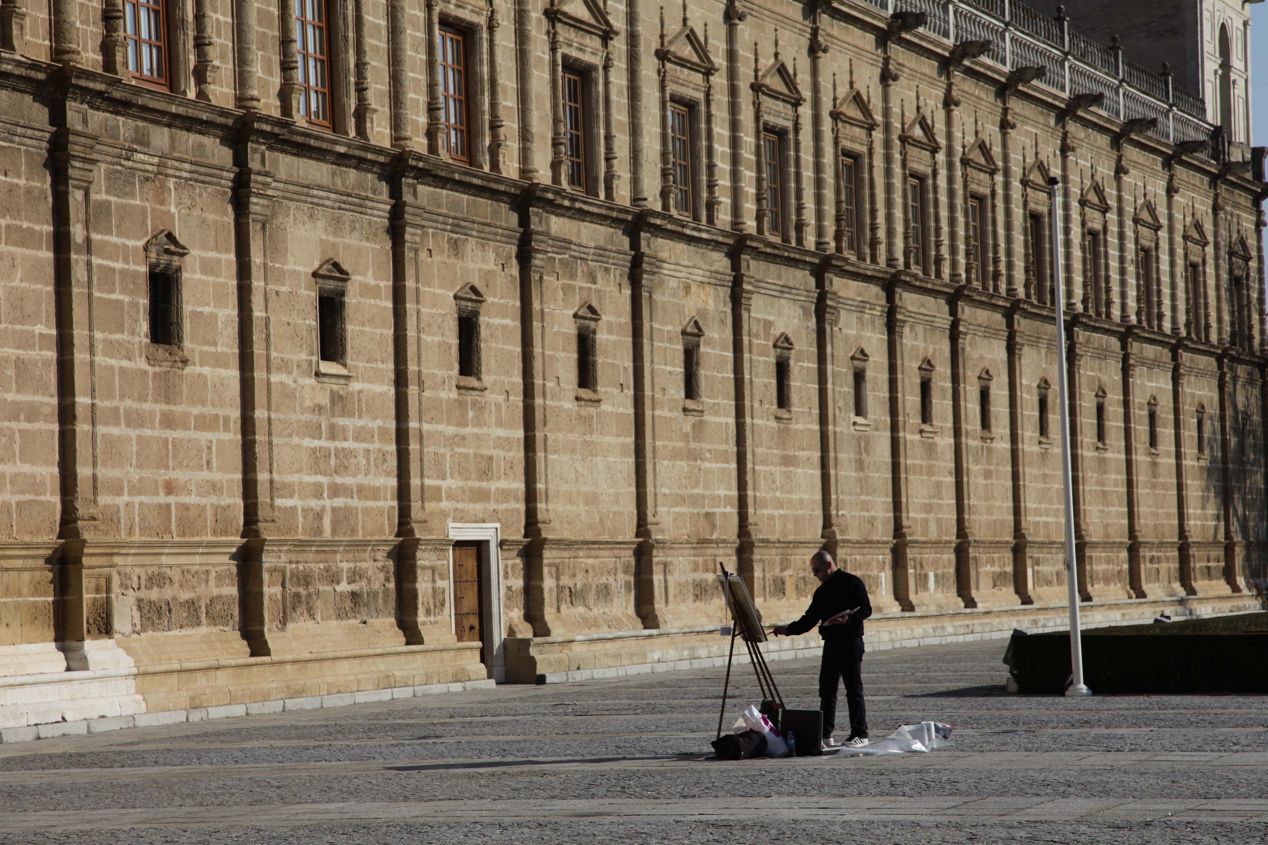 Un pintor plasmando en su lienzo la fachada del Parlamento